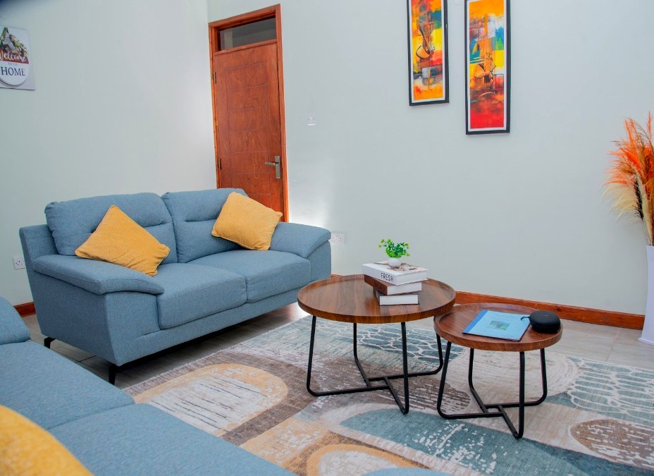 Blue sofas and yellow cushions at 64 West